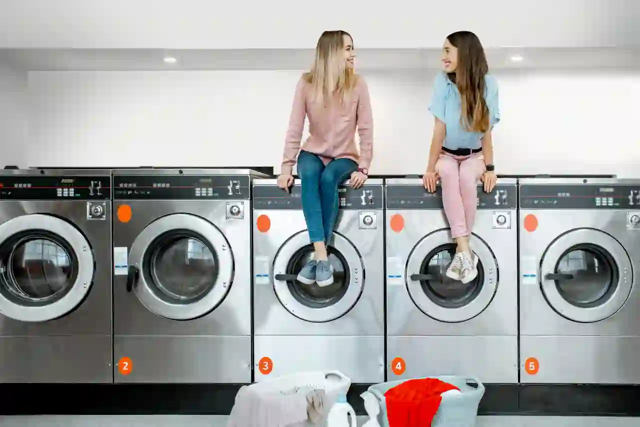 Women using laundromat